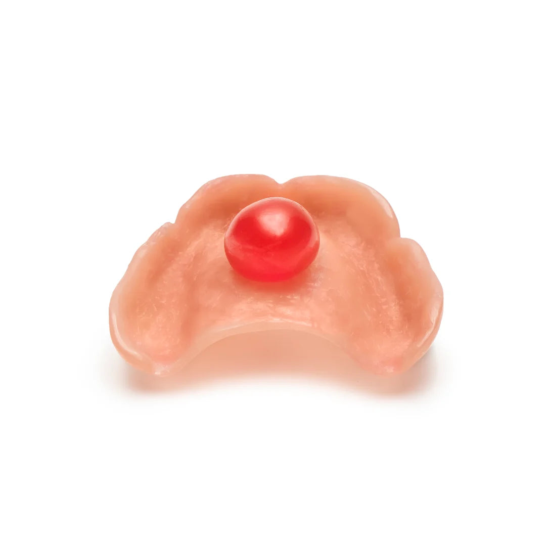 Cherry-sized amount of DinaBase7 adhesive gel applied to an upper denture